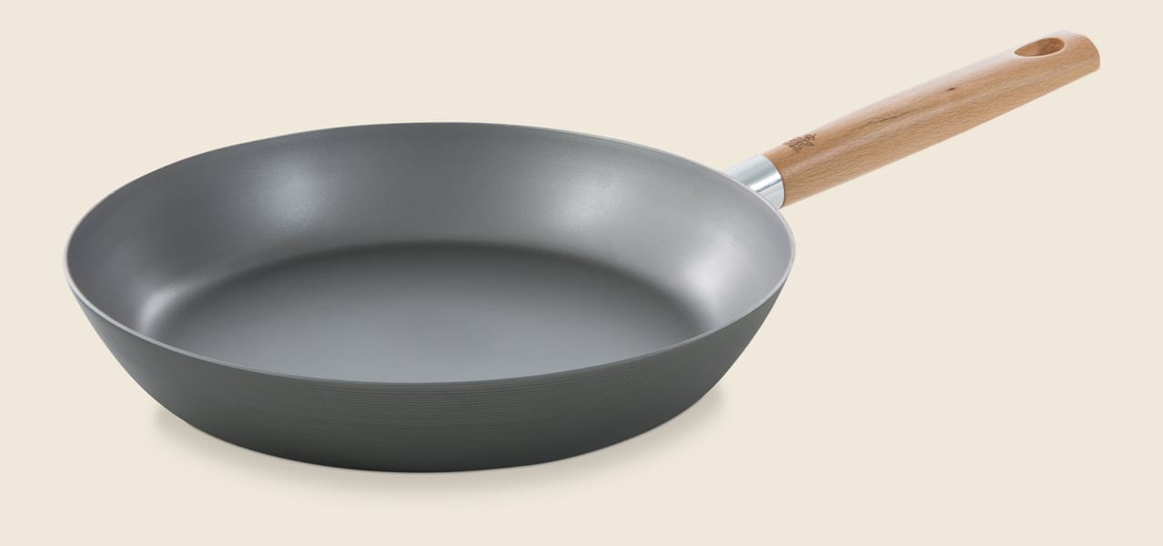 Graphite frying pan with wooden handle and speckled non-stick interior